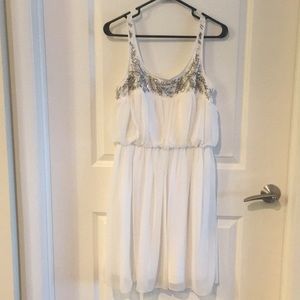 White dress with silver beefing at top